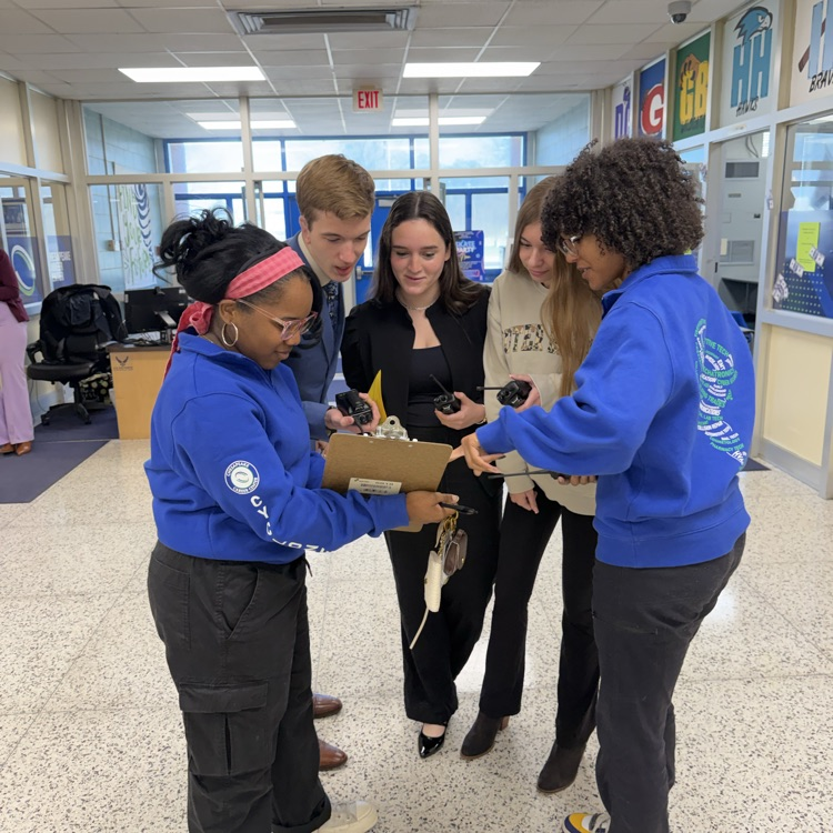 students debrief before the drill