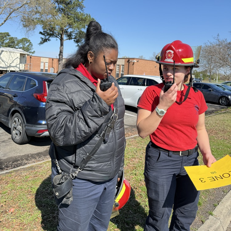 fire fighting students checking on the drill