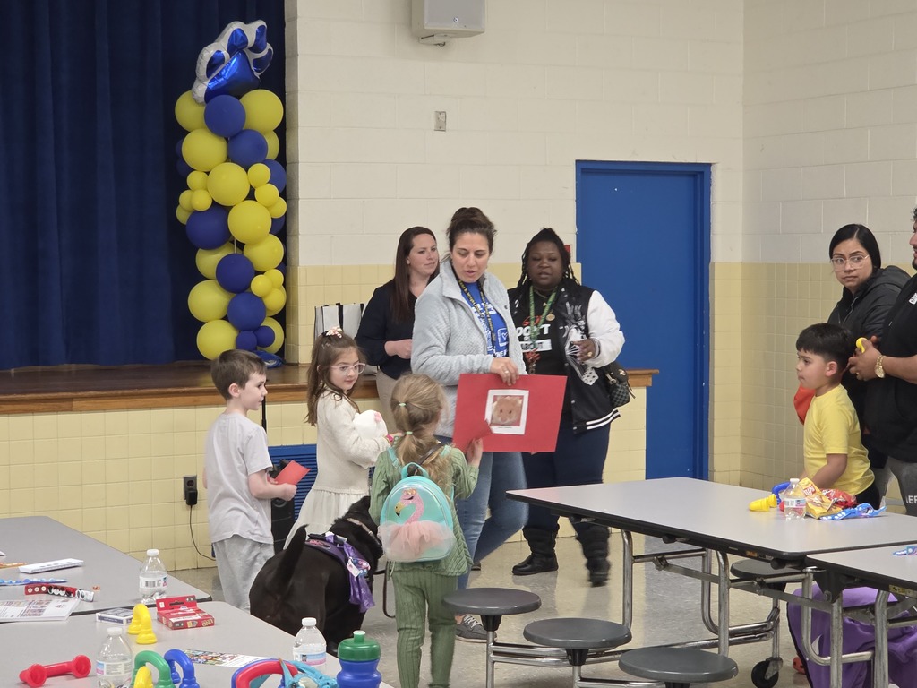 Families lining up for station rotations.