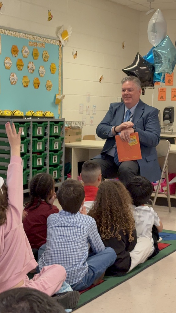 Dr. Cotton reading to Ms. Satchell's class