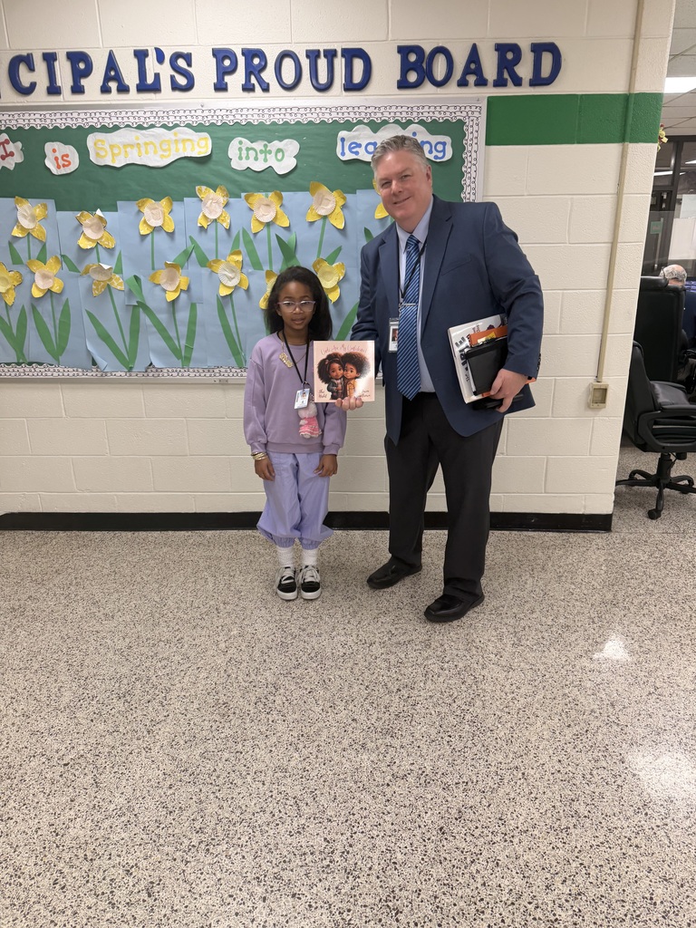 Dr. Cotton reading to Ms. Satchell's class