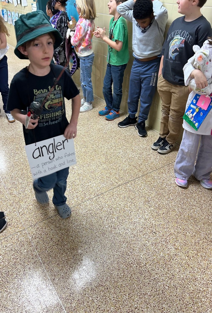 students walking in a parade dressed up for the vocabulary parade