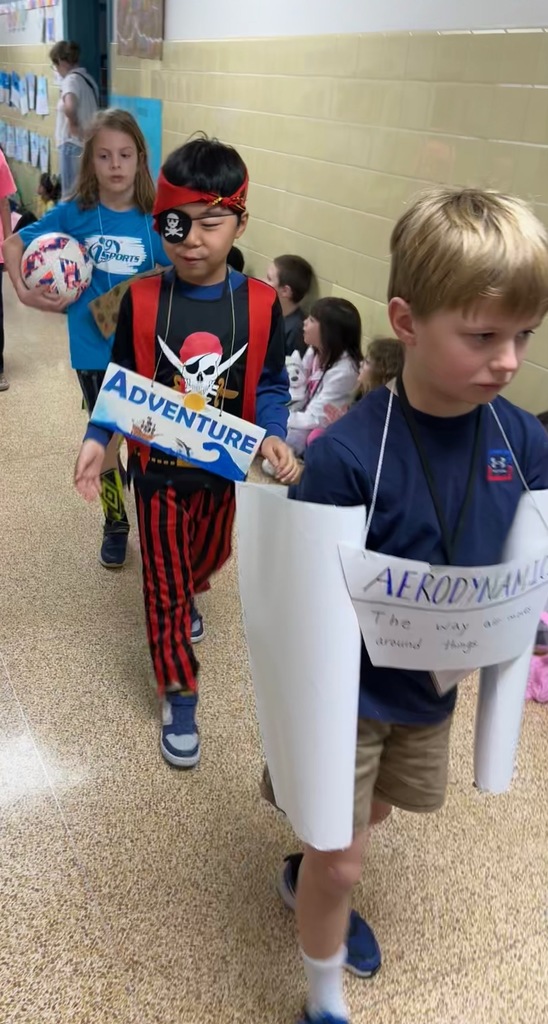 3 students dressed up for the vocabulary parade 