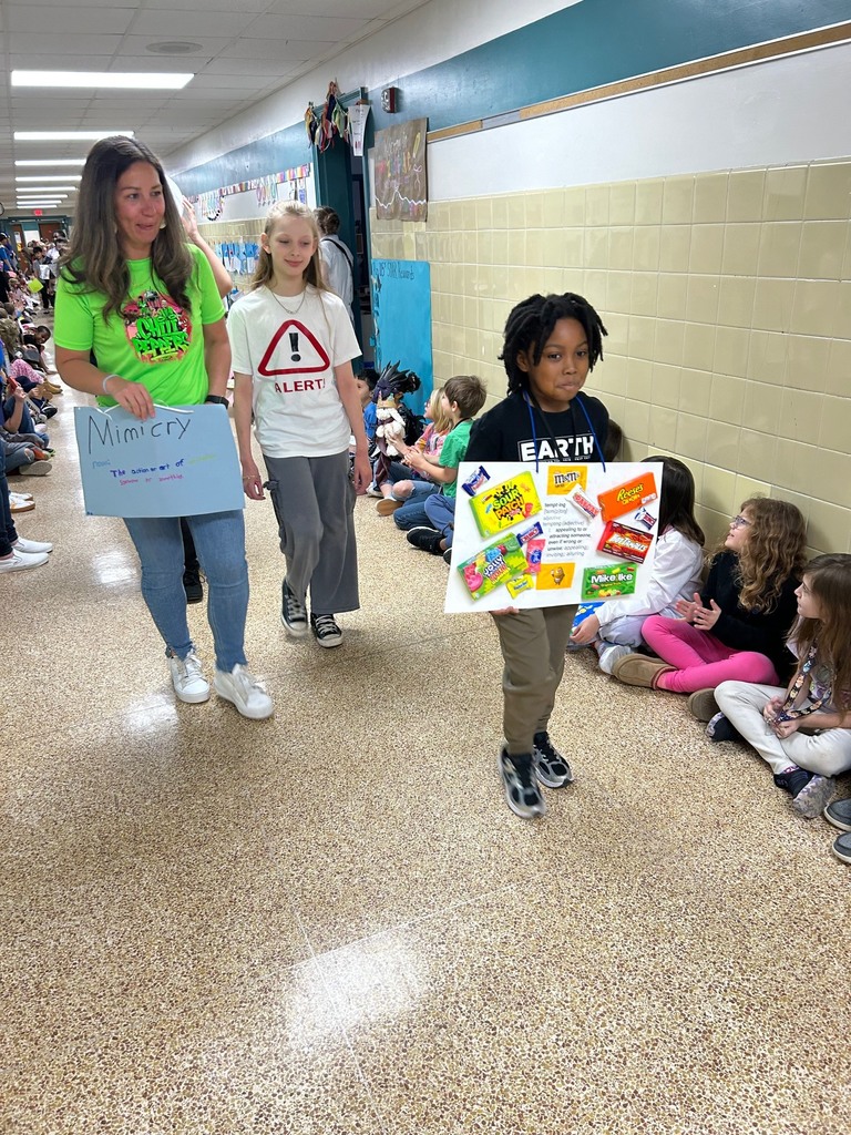 students walking in a parade dressed up for the vocabulary parade