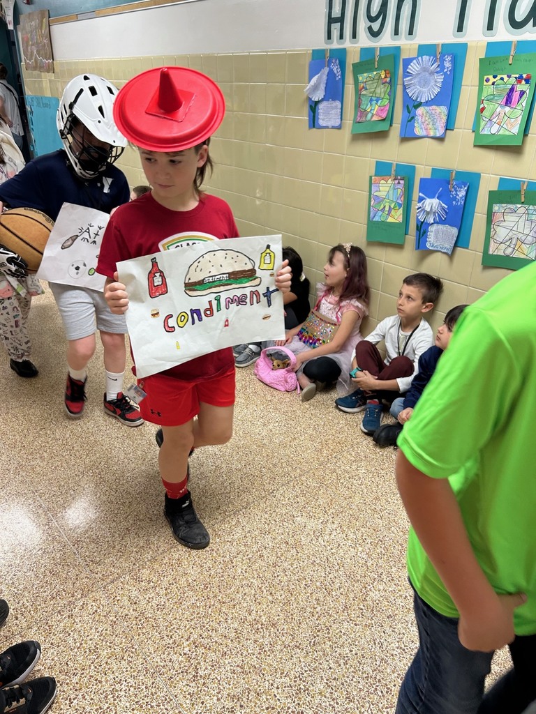 students walking in a parade dressed up for the vocabulary parade