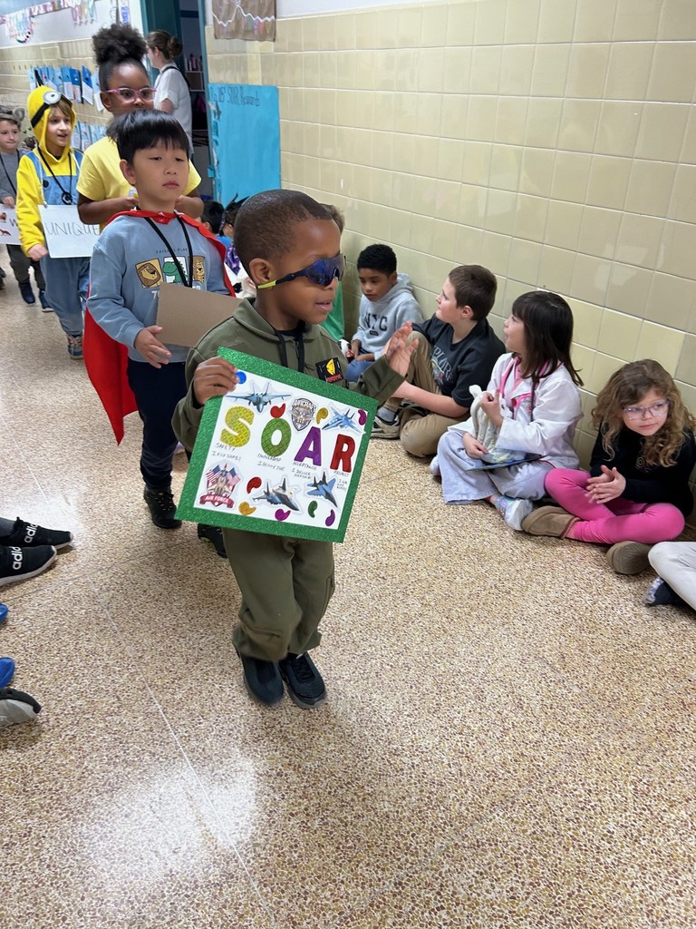 students walking in a parade dressed up for the vocabulary parade