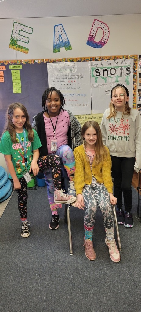 4 students dressed up for mismatch day 