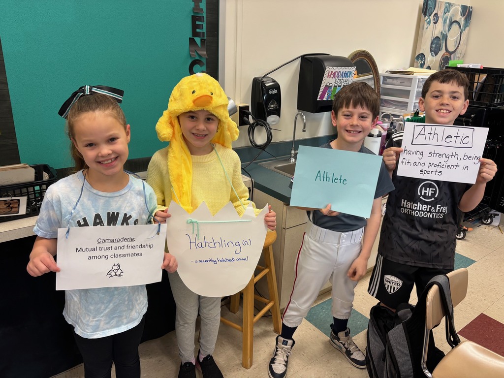 4 students dressed up for vocabulary day parade 