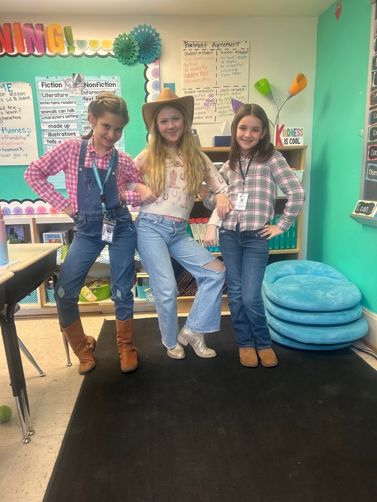 3 students dressed up for farm spirit day 
