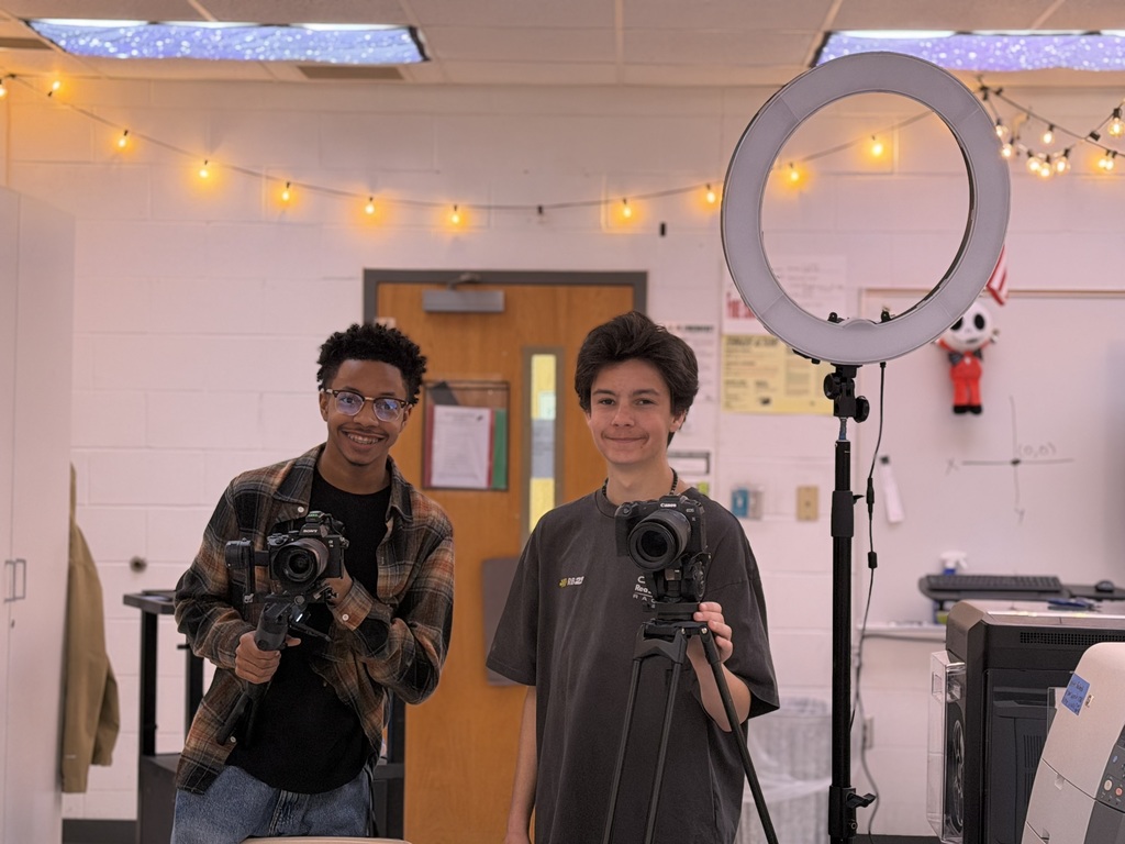 Students proudly posing with their recording equipment