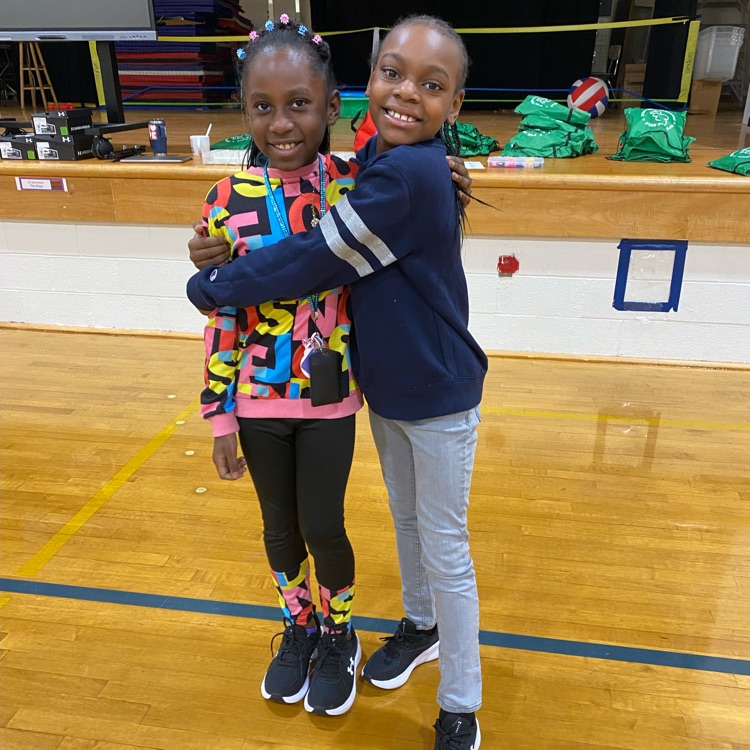 two students excited about their new sneakers 