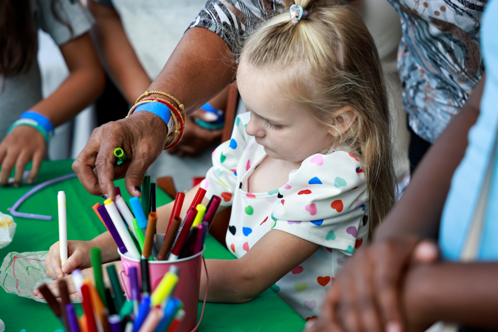 young student drawing colorful picture intently