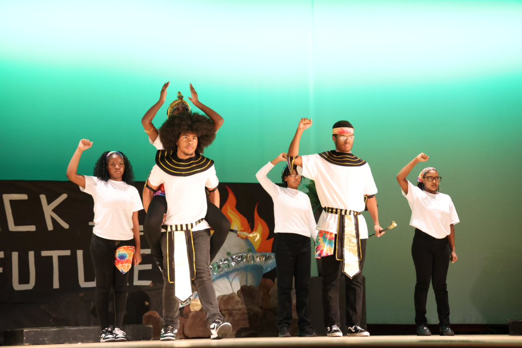 students celbrating with a stage performance