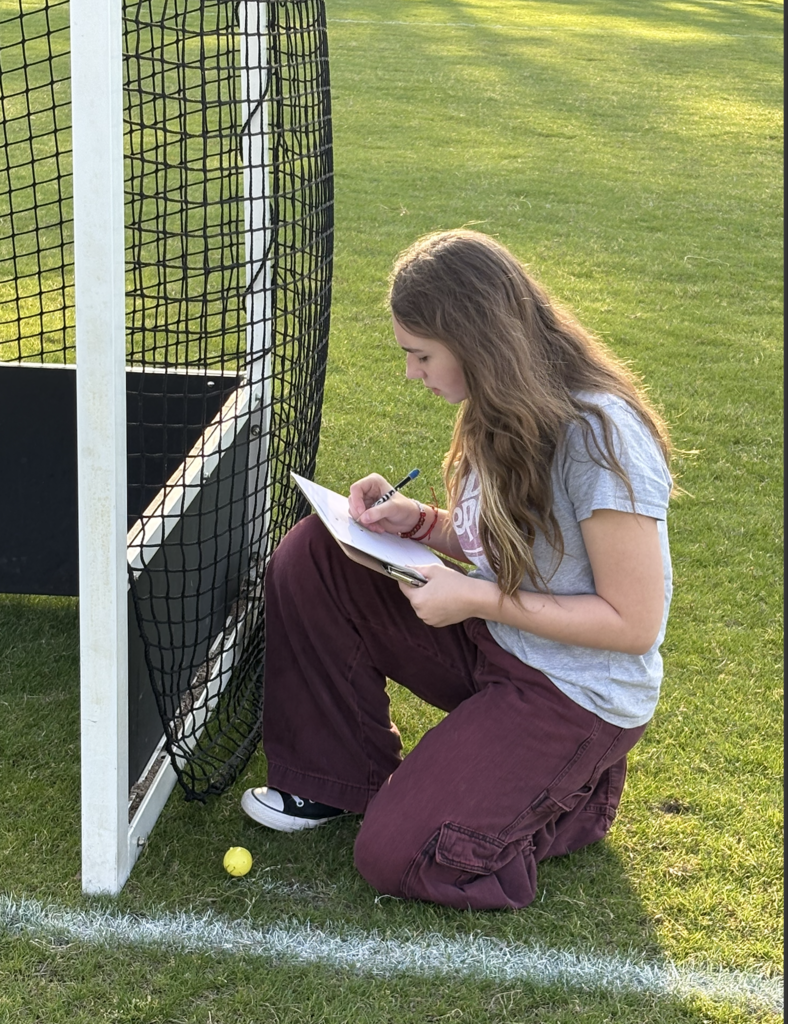student working diligently on a math problem fro the egg she found