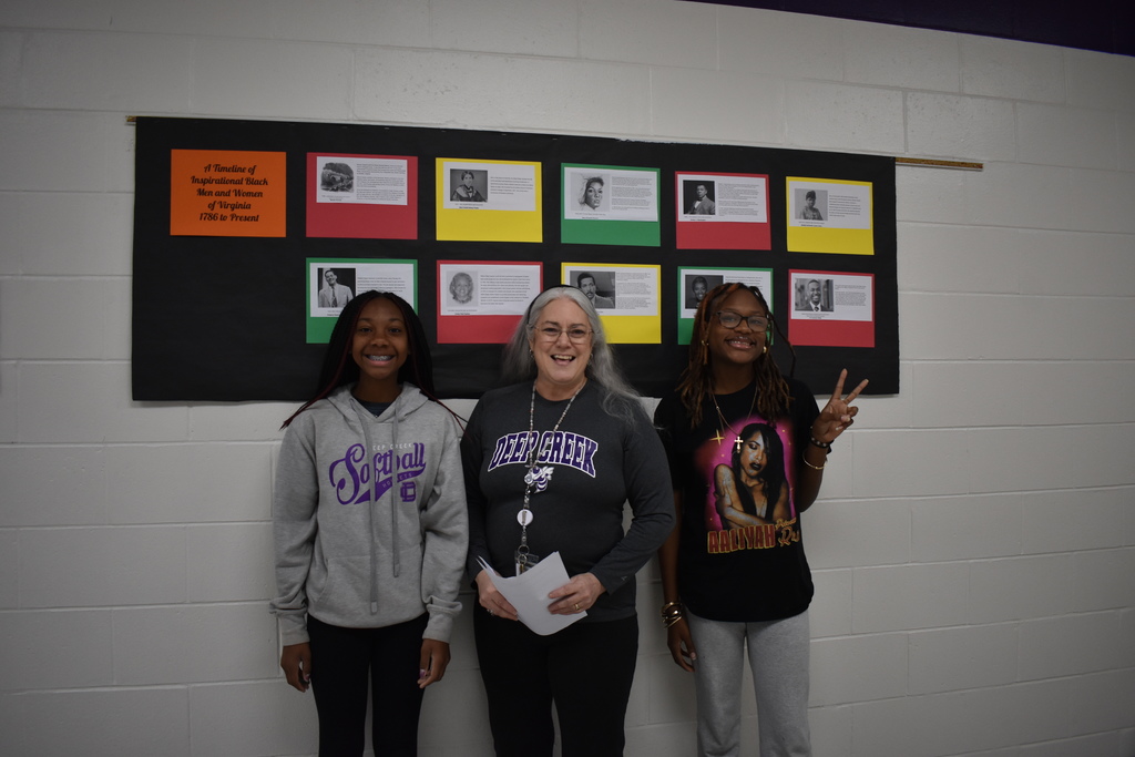 A teacher and two students posing their athletic gear