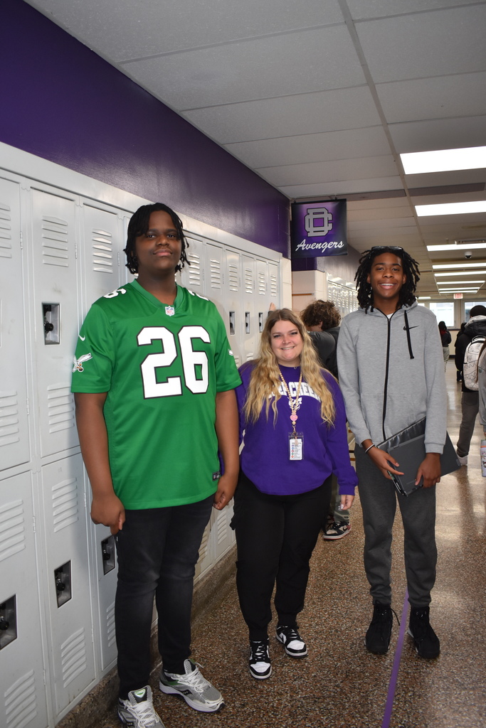 A teacher and two students wearing a their athletic gear
