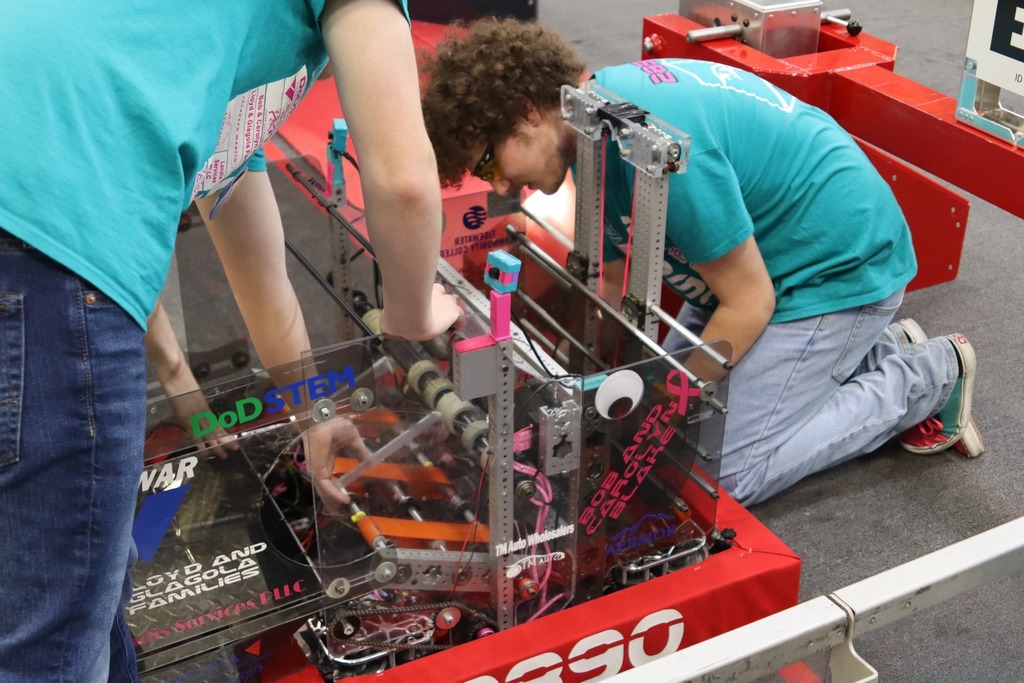 A HHS Robotics team member working on the robot.