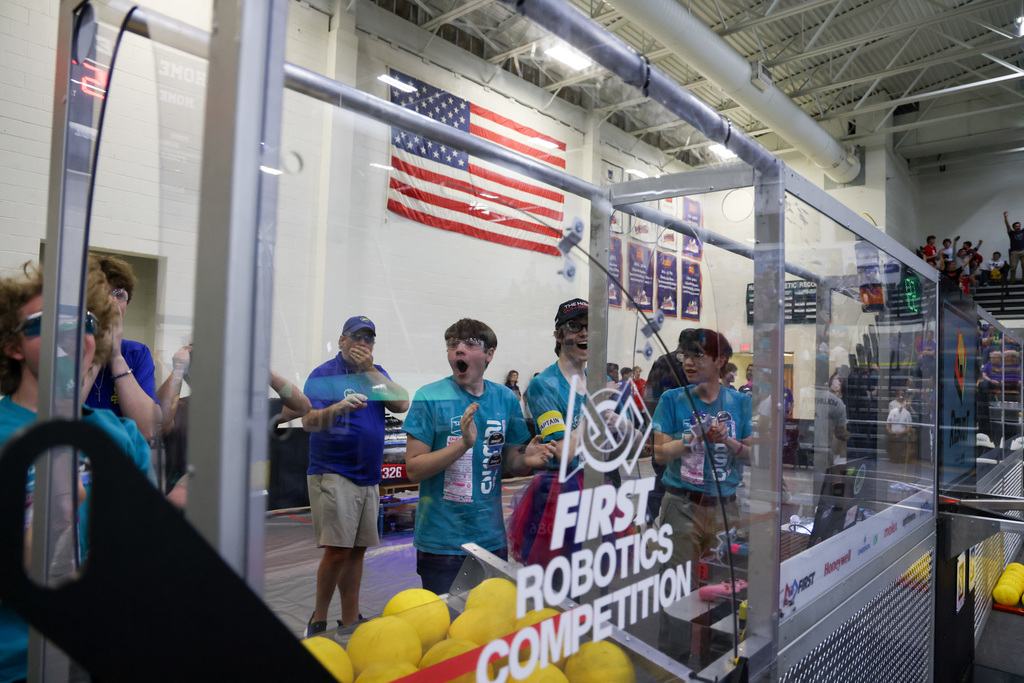 The HHS Robotics team happy from their latest match.