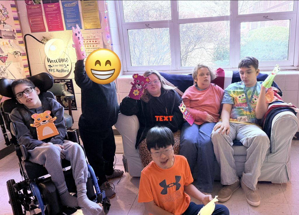 Students proudly posing with their handmade puppets