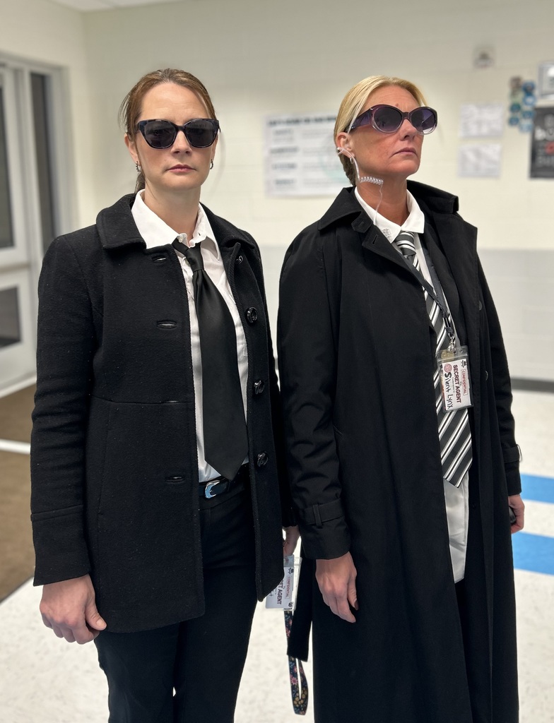 Two female teachers dressed as secret agents