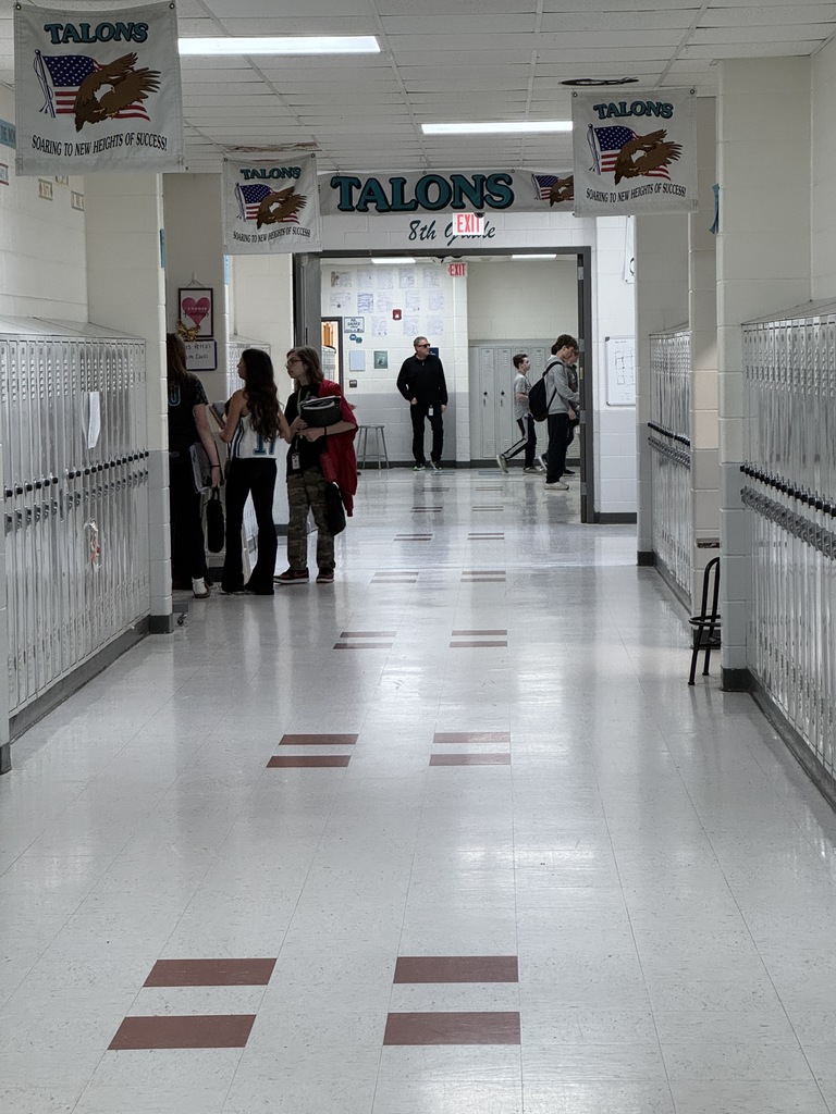 A teacher at the end of the hall dressed as a secret agent