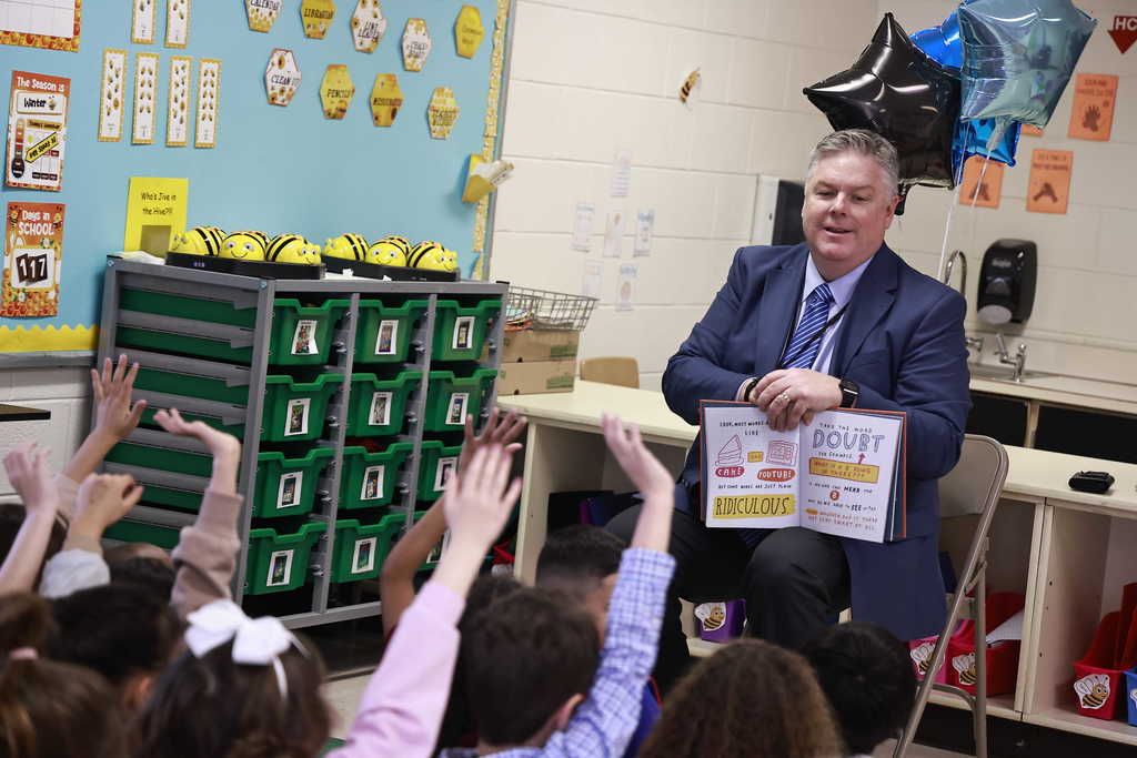 Dr. Cotton listens as a student answers a question.