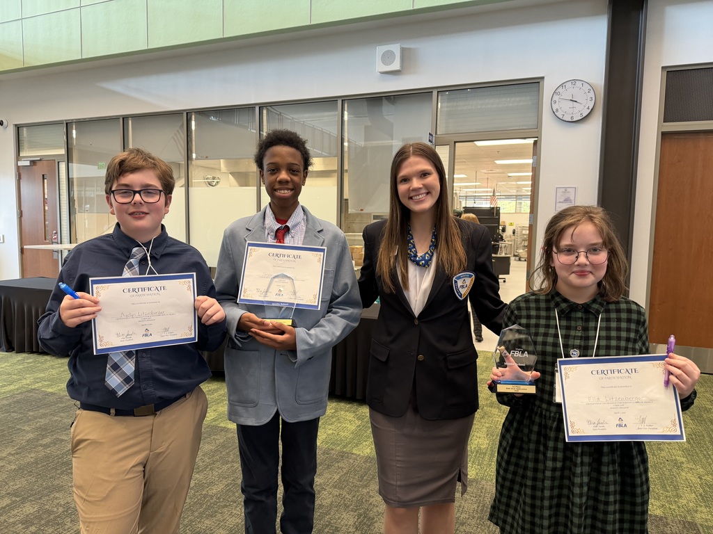 FBLA students standing with their awards at the competition