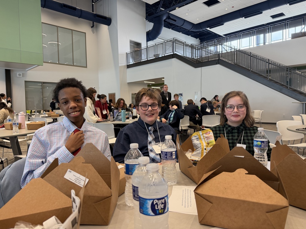three students at the FBLA competition 