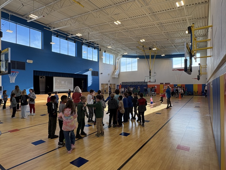 students playing an activity in the gym! All students who signed up by this morning got to celebrate together! 