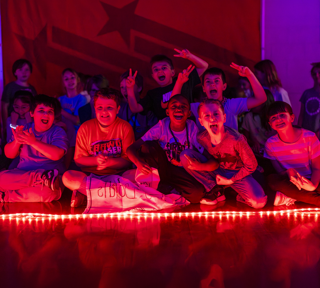 Boosterthon GLOW run students smiling