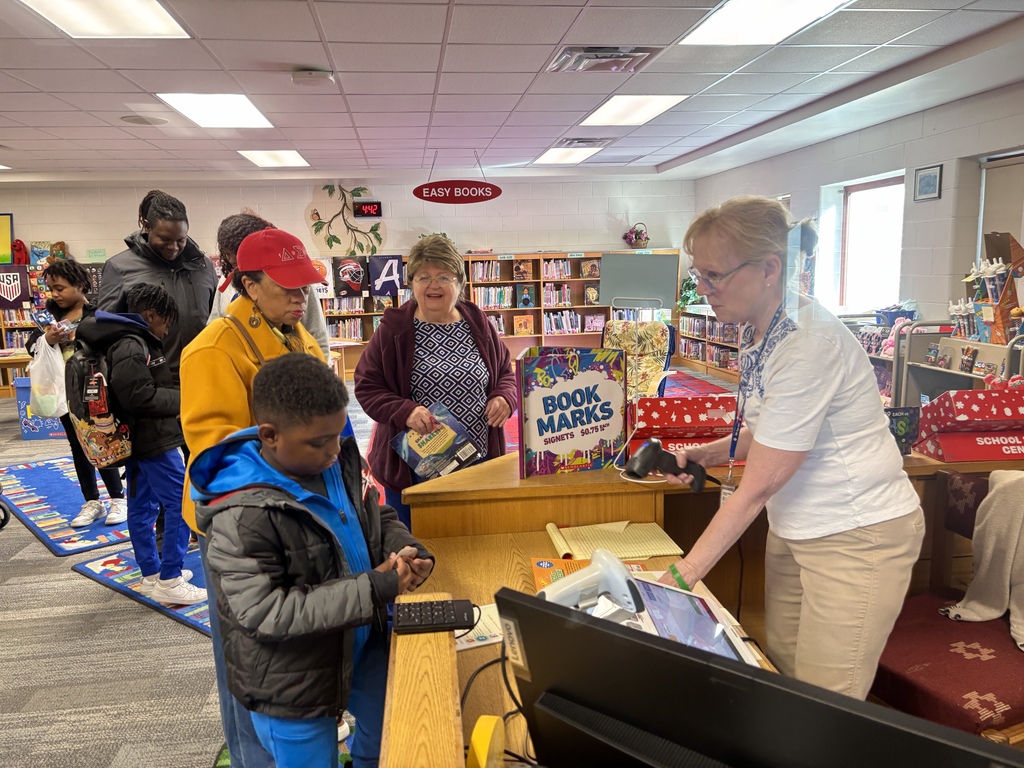 Families in line to purchase books at the book fair