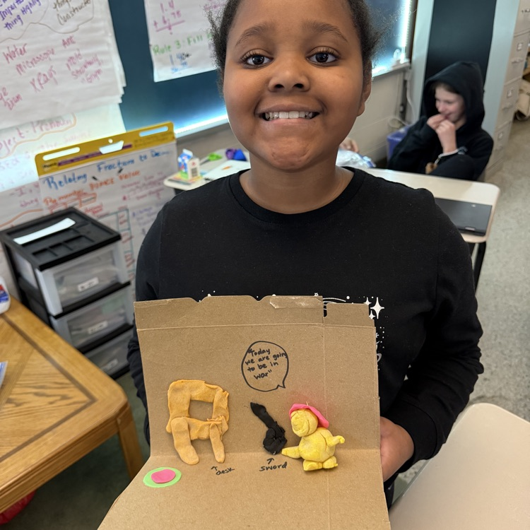 Student showing off their Presidential Action figure. 