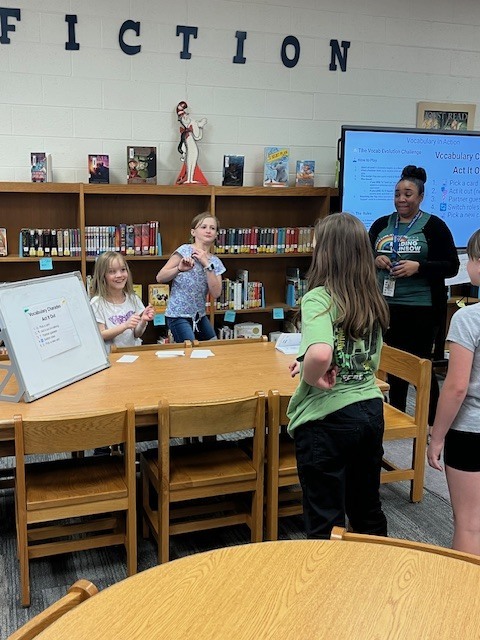 Students excitedly working together to play Vocabulary in Motion!