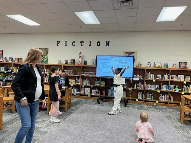 Students excitedly working together to play Vocabulary in Motion!