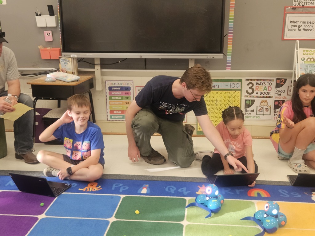 Students coding Dash robots