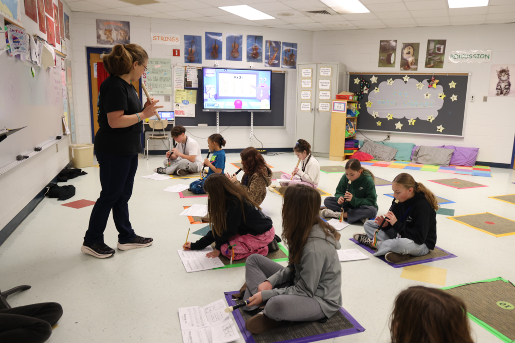 focus and practicing the recorder in class makes celebrating arts month fun