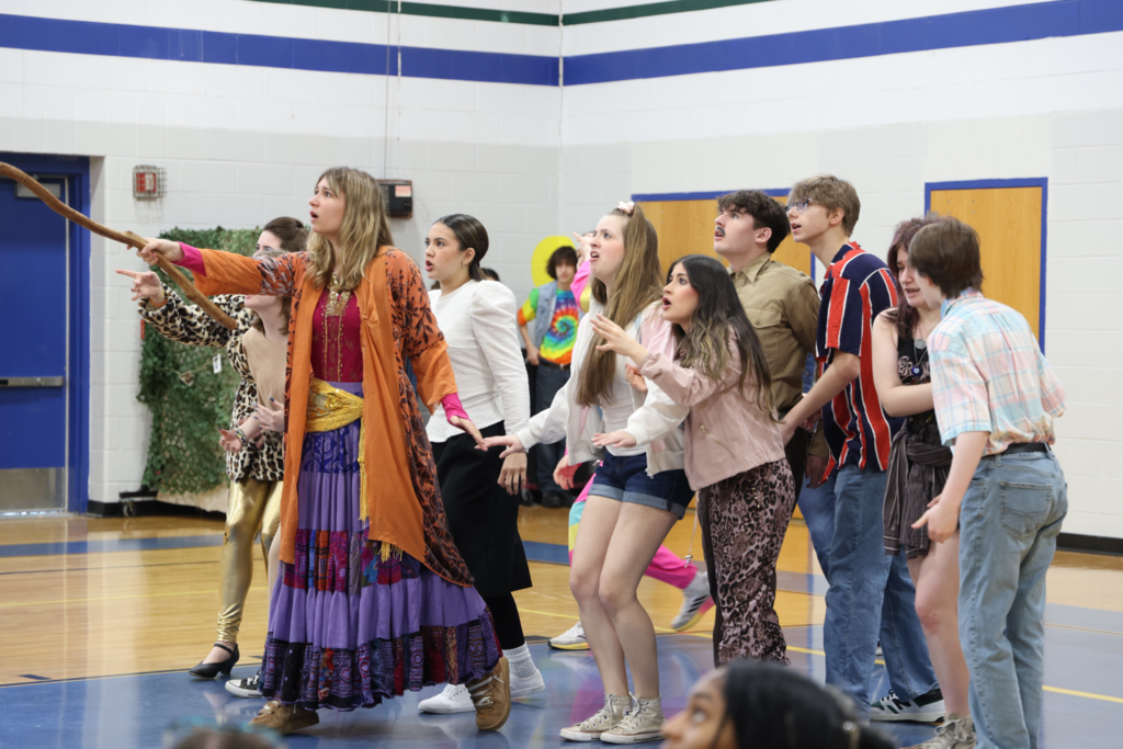 performers from grassfield are shocked by the sight they see in the distance