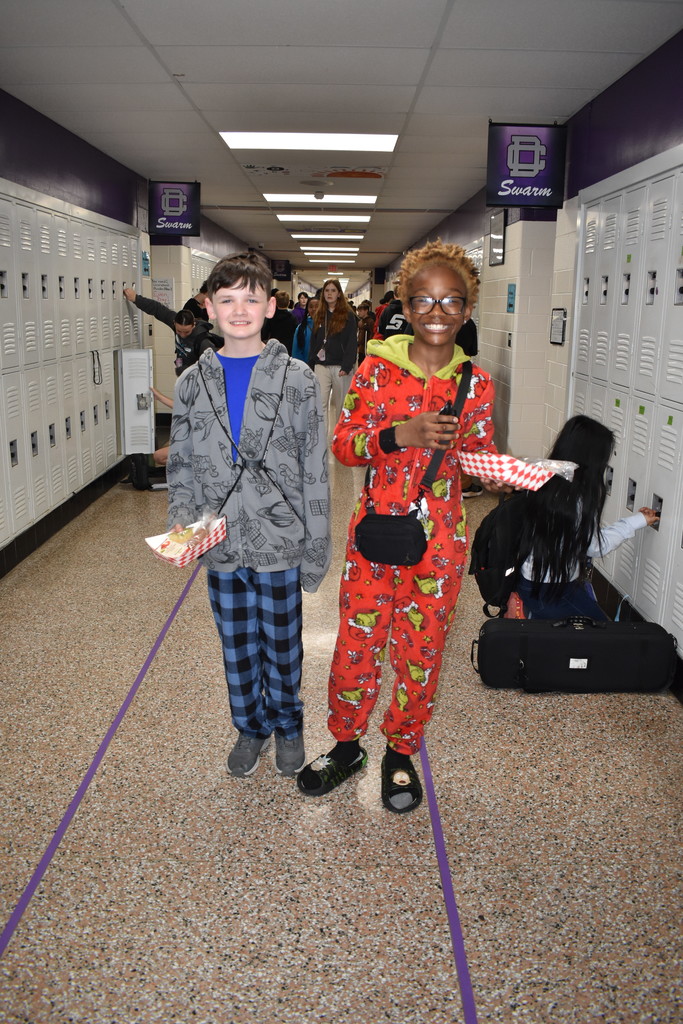 Two students coming from lunch in their pajamas