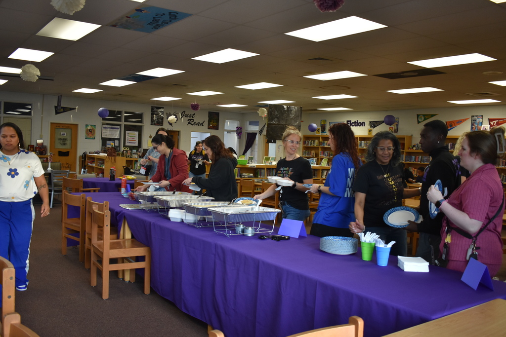 A line of teachers grabbing their breakfast!