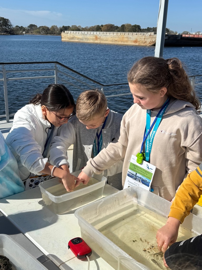 students exploring water on the learning barge 