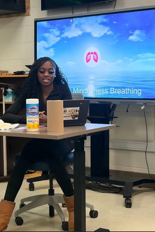 students practicing breathing