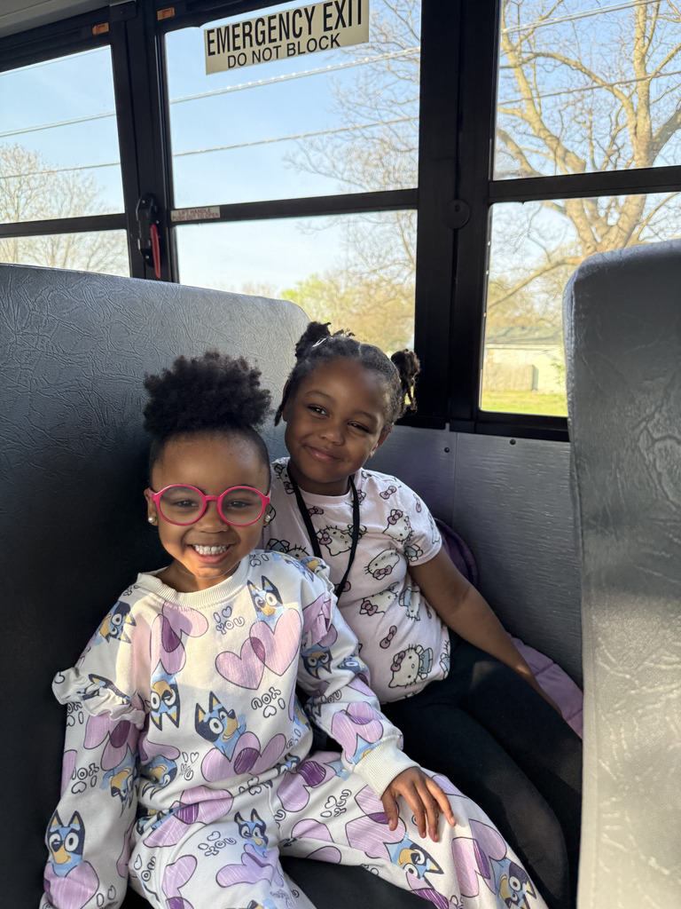 2 students riding on school bus