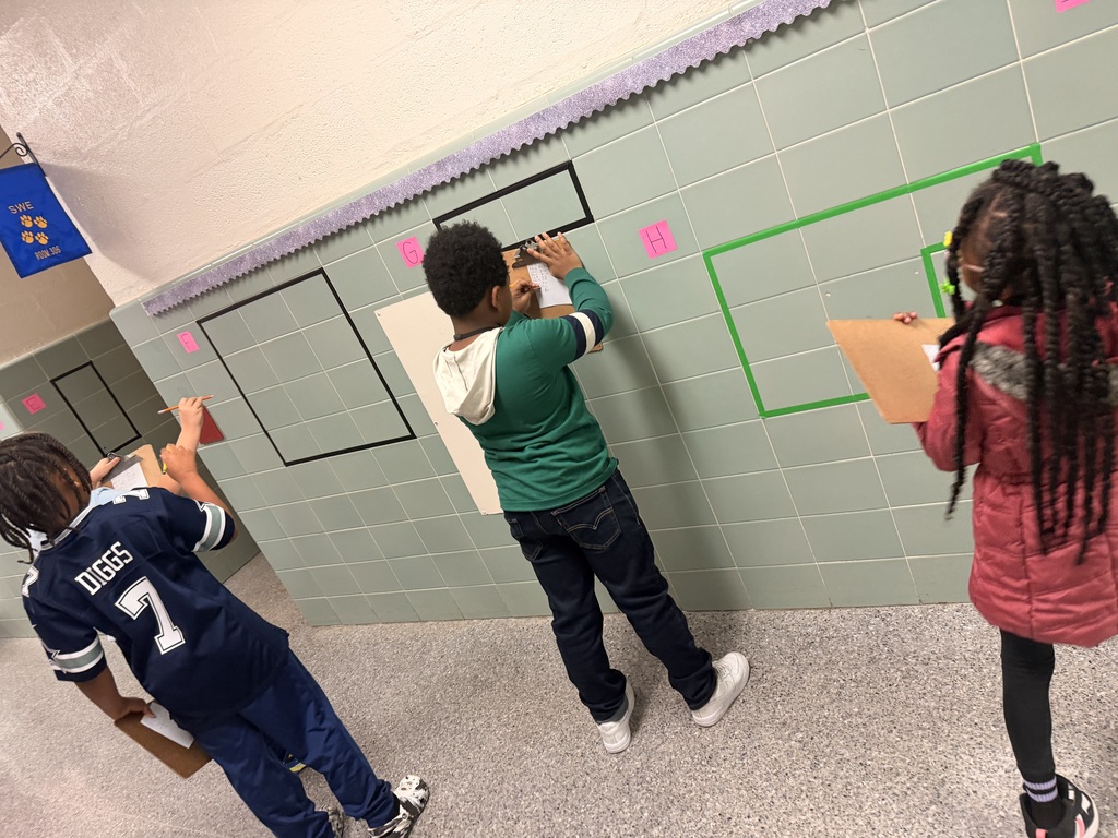 students solving area and perimeter math problems