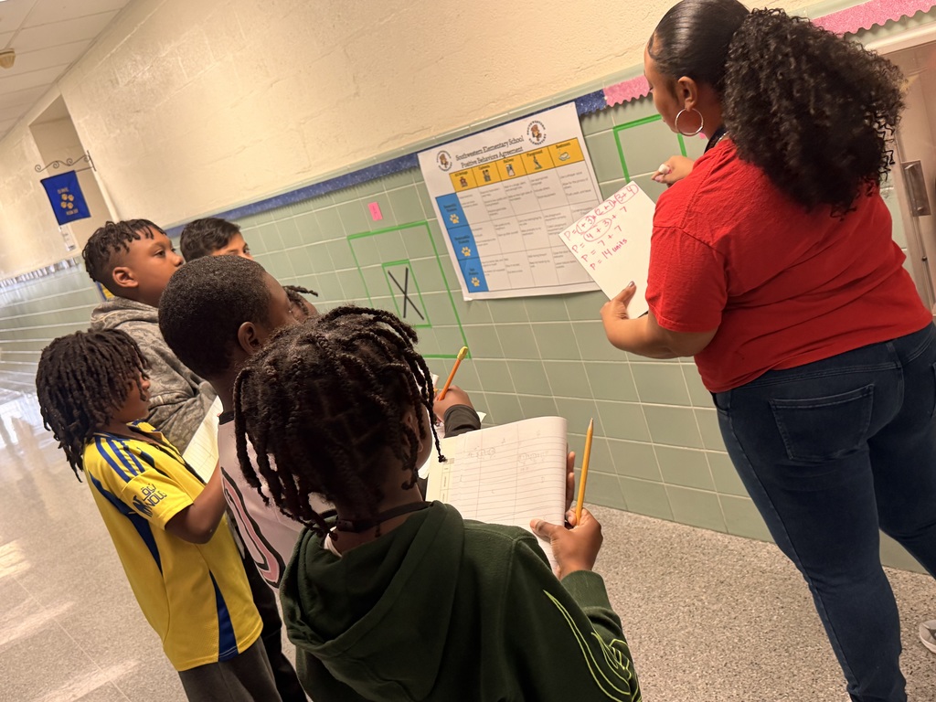 students solving area and perimeter math problems