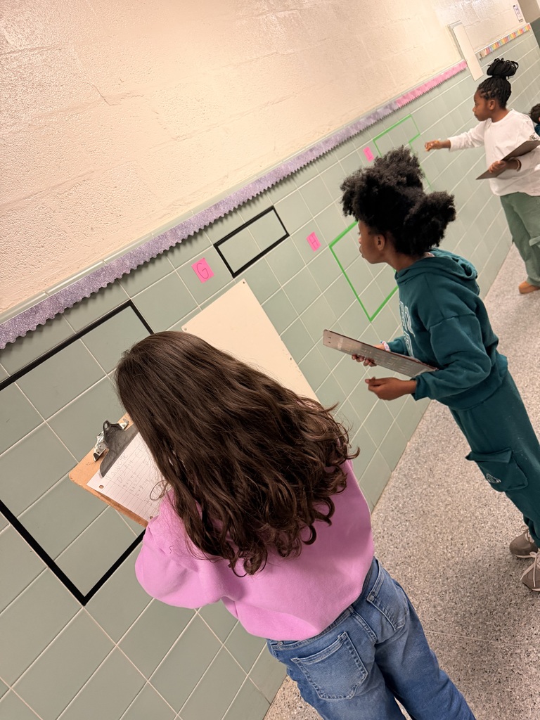 students solving area and perimeter math problems