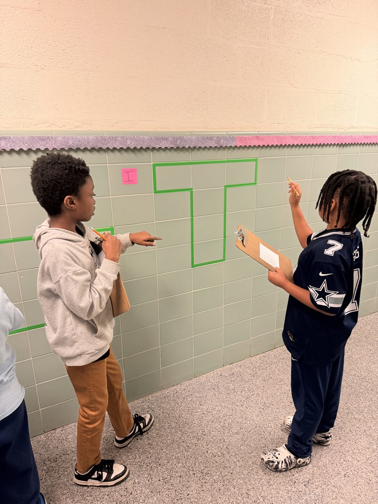 students solving area and perimeter math problems