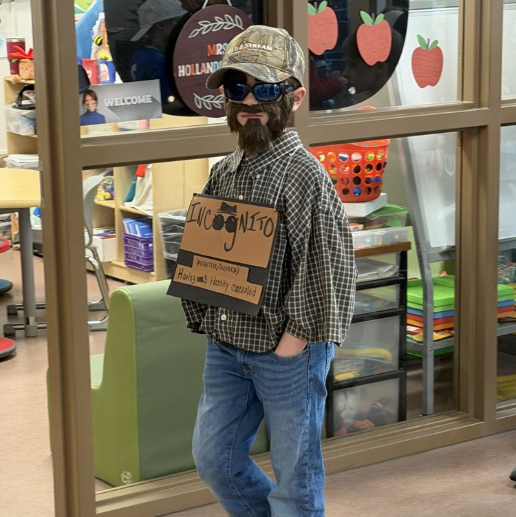 student dressed in a disguised as word “Incognito"