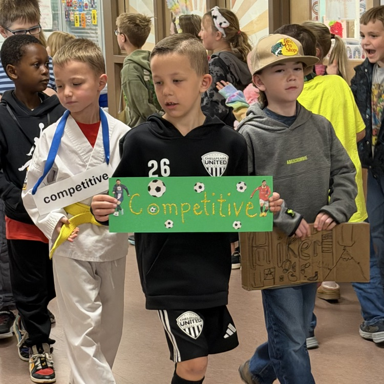 group of boys showing off their words and costumes in the vocabulary parade