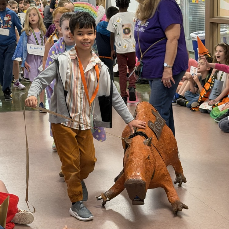 student showing off his rodent in the vocabulary parade