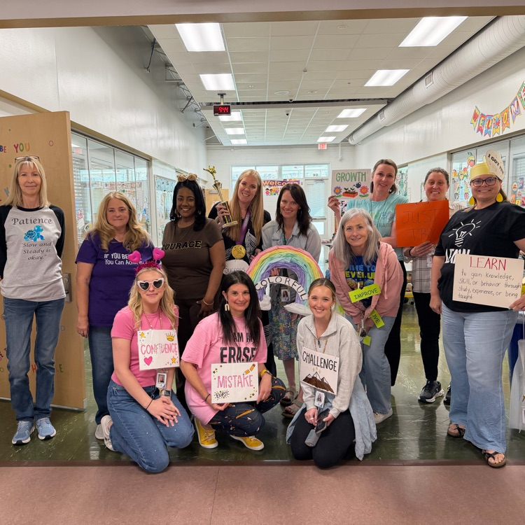 second grade teachers posing in their growth mindset costumes after the vocabulary parade